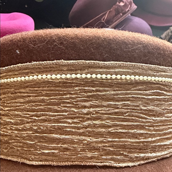 Elegant Brown Hat with Cream Floral Accent